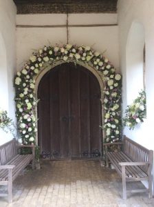 Roses over a doorway leading us into the heady days of summer
