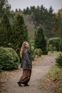 Woman walking along road