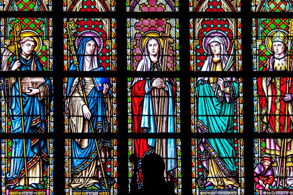 Stained glass windows often depict different saints
