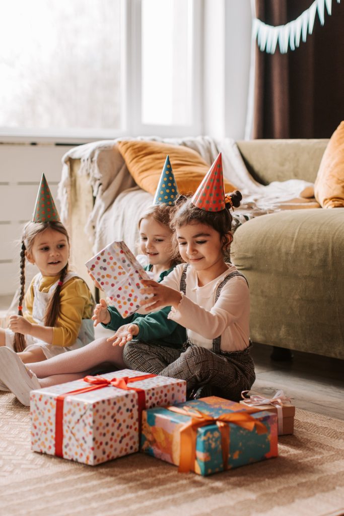 Fun and joy as children enjoy opening gifts